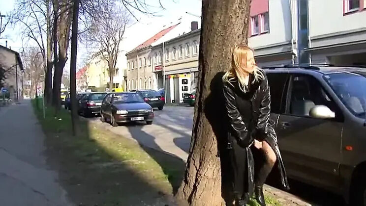 Blonde dominatrix pissing outdoors on city street - public flashing & fetish urination